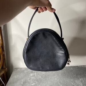 Vintage Black Leather Made in France Circle Small Handbag Zip Closure.